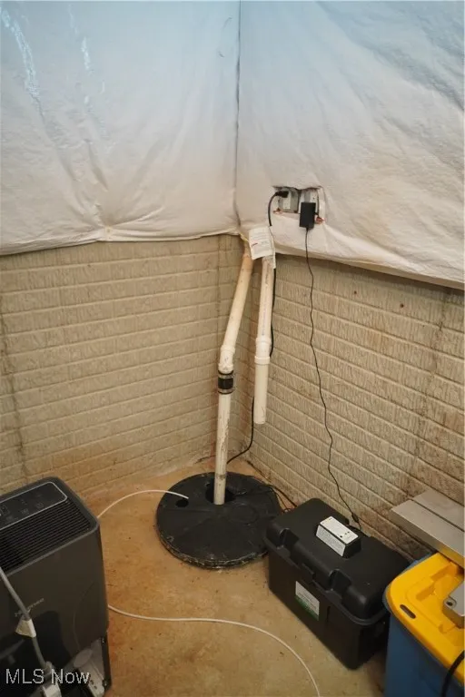 Basement view of concrete floors and drainage system