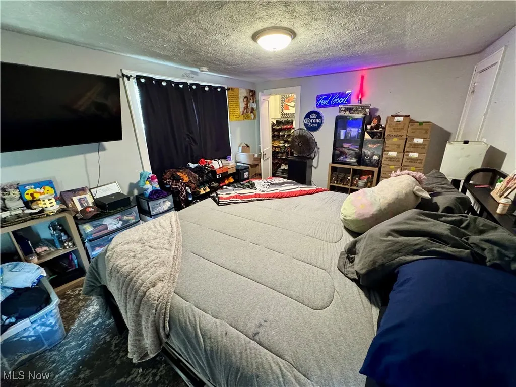 Bedroom featuring a textured ceiling