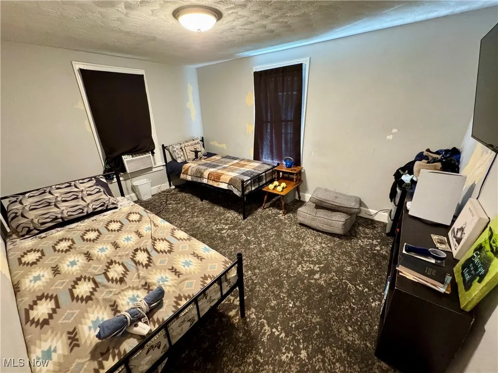 Bedroom featuring a textured ceiling