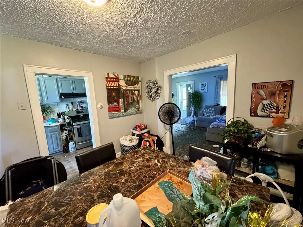 Dining area featuring a textured ceiling
