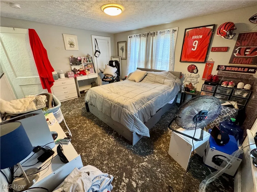 Bedroom featuring a textured ceiling