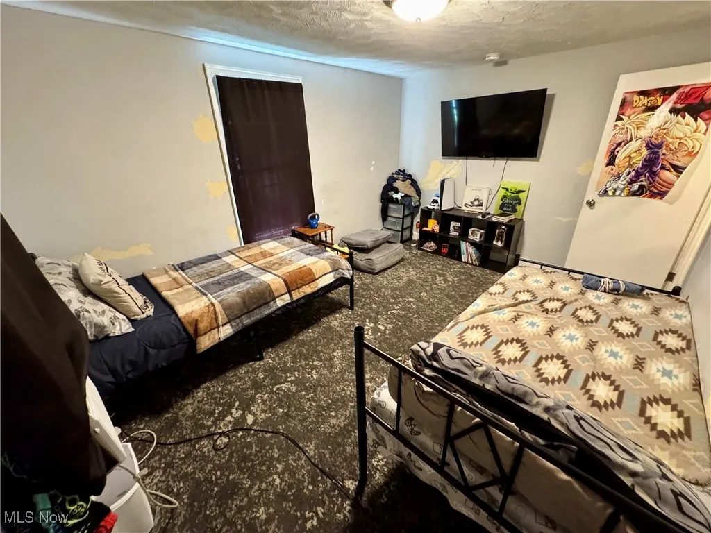 Bedroom featuring a textured ceiling