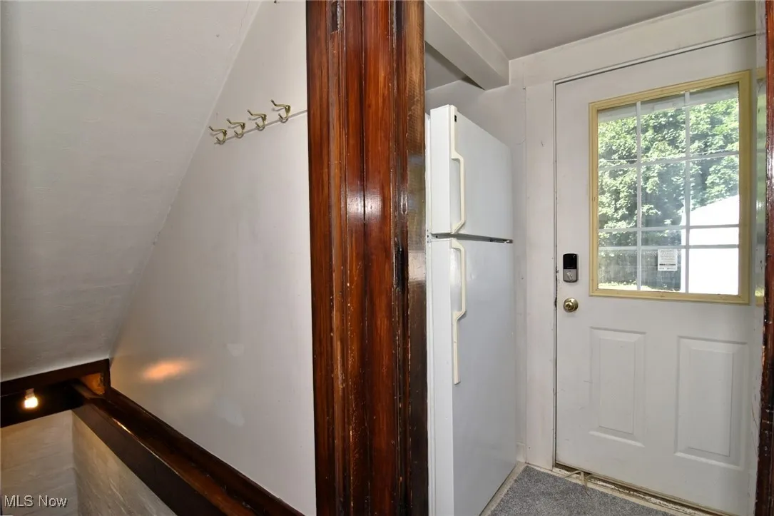 Kitchen with freestanding refrigerator