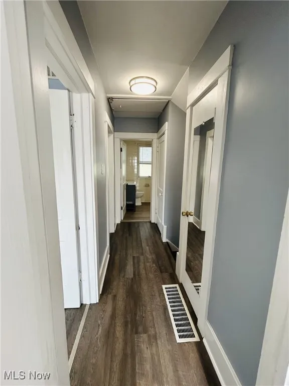 Hallway featuring wood-type flooring