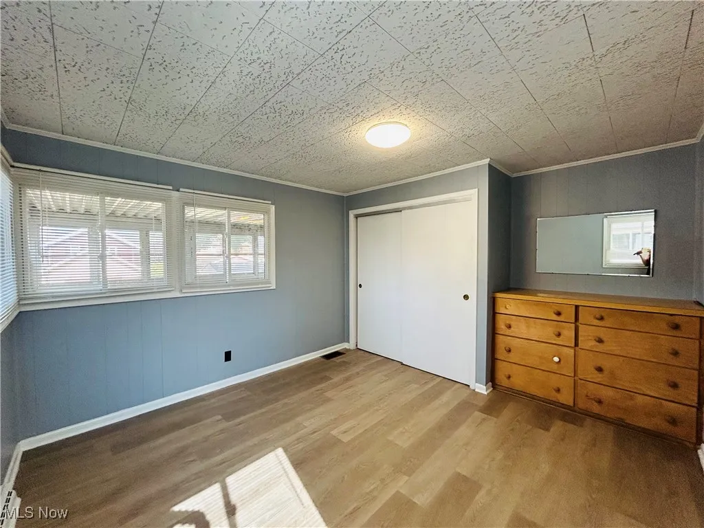 Bedroom featuring a closet and dresser