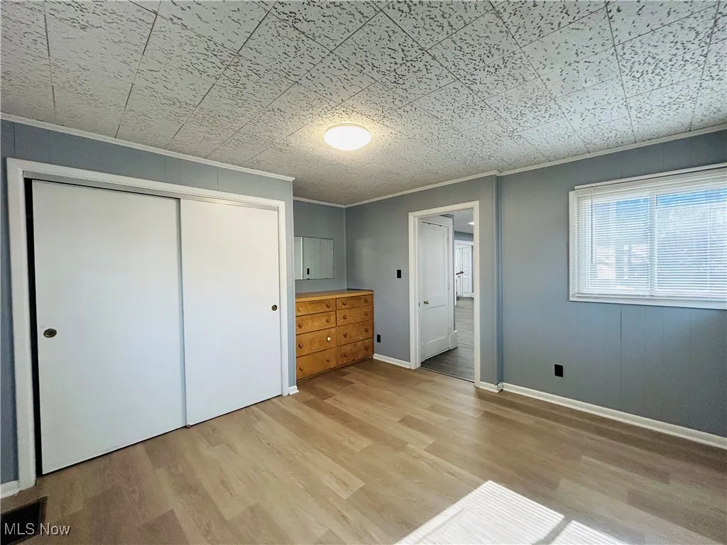 Bedroom featuring a closet and dresser