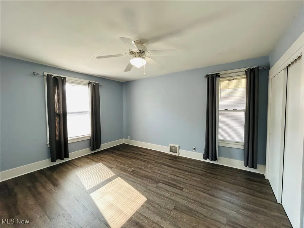 Bedroom with a ceiling fan and closet
