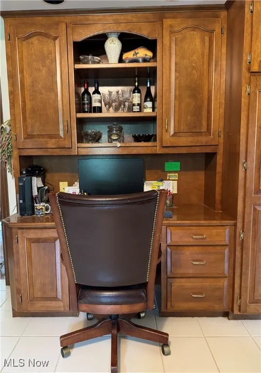 Home office with light tile patterned floors
