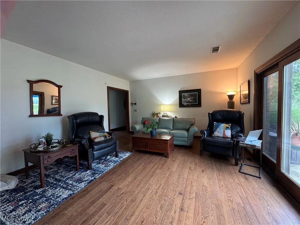 Living area featuring healthy amount of natural light and wood finished floors