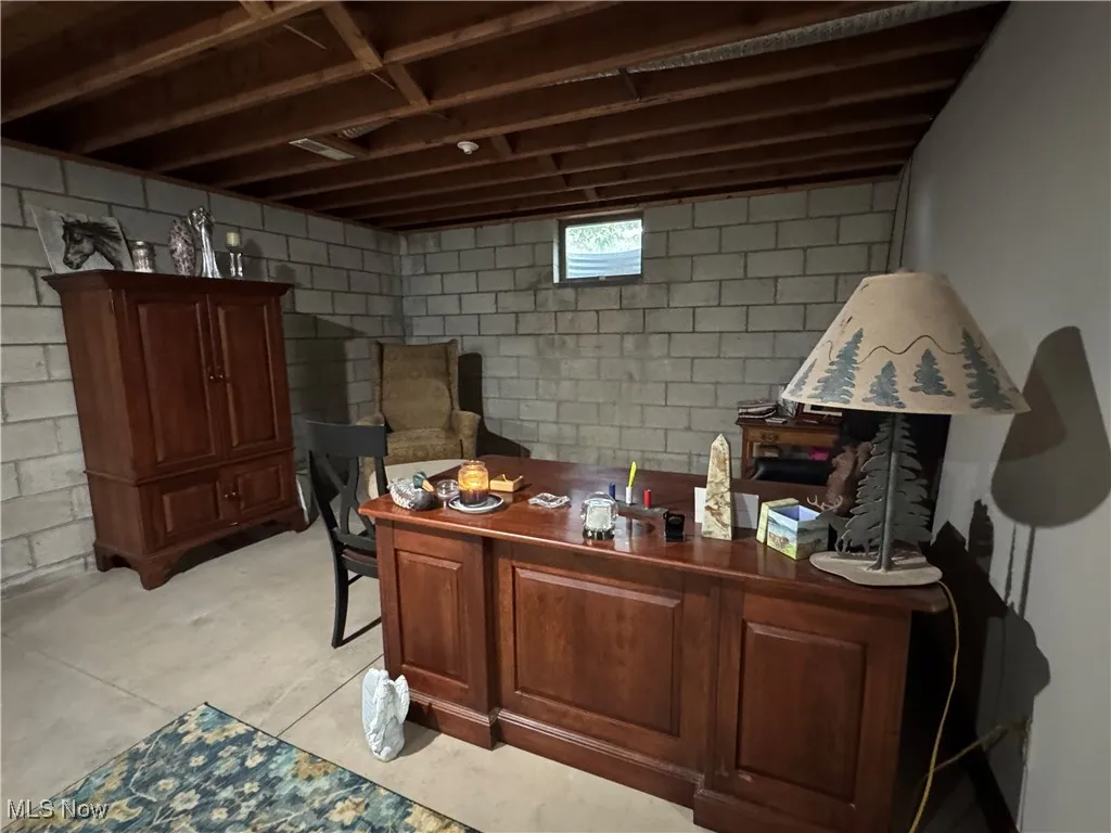 Office space featuring unfinished concrete floors