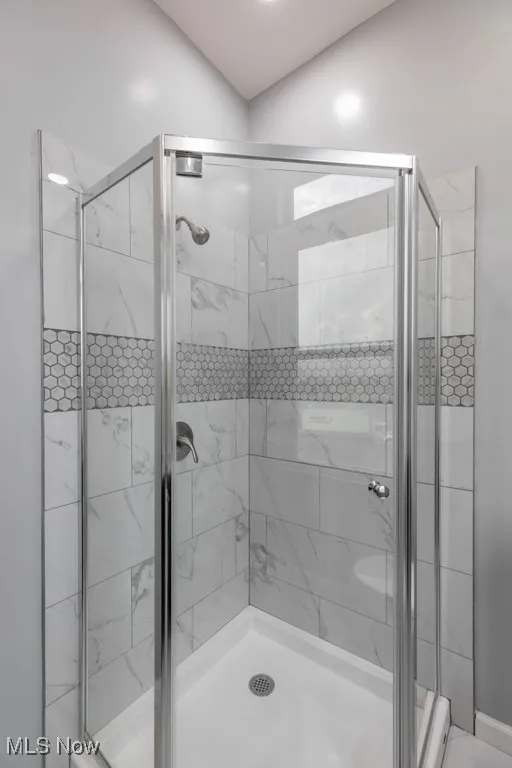 Shower in full bath on second floor off of staircase.