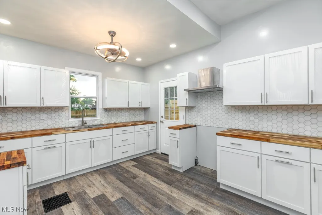 Huge brand new kitchen with crisp white cabinets.