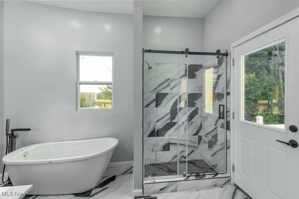 Wowing master bathroom.  Door leads to the outside balcony.