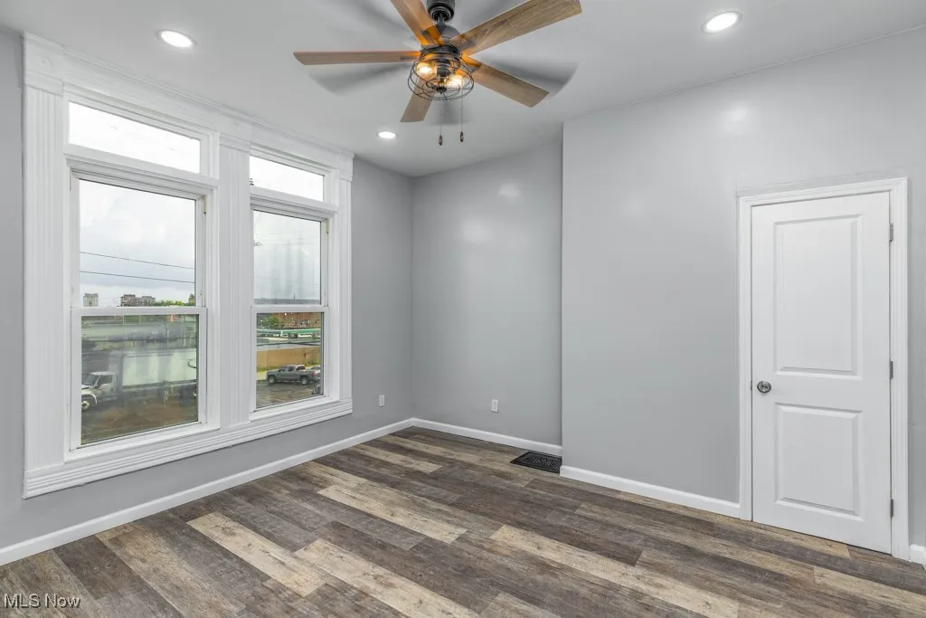 Bedroom 1 with ceiling fan.