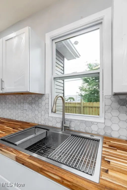 Nifty new sink, faucet and pretty tile backsplash.