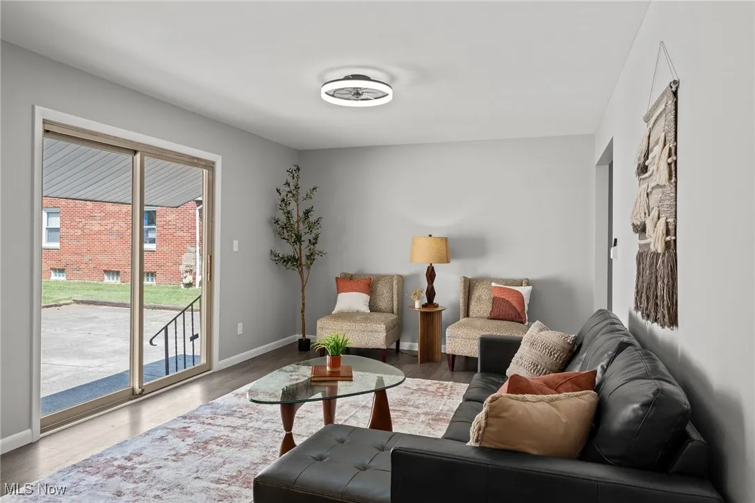 Living room with wood finished floors and baseboards