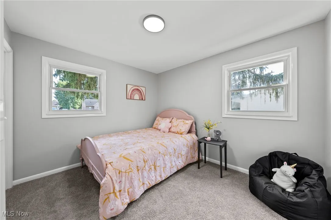Carpeted bedroom with baseboards