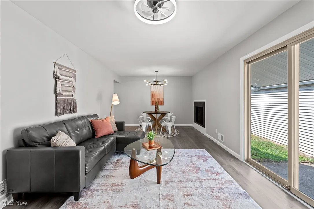 Living room with wood finished floors and a chandelier