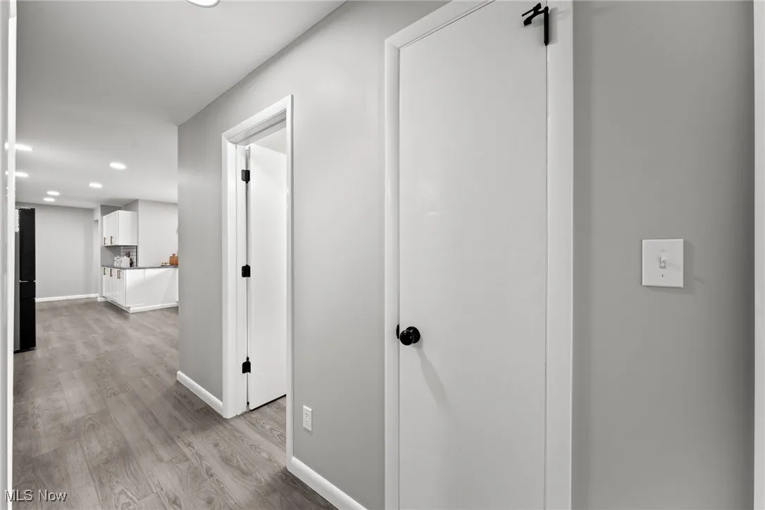 Hallway featuring recessed lighting and light wood-type flooring