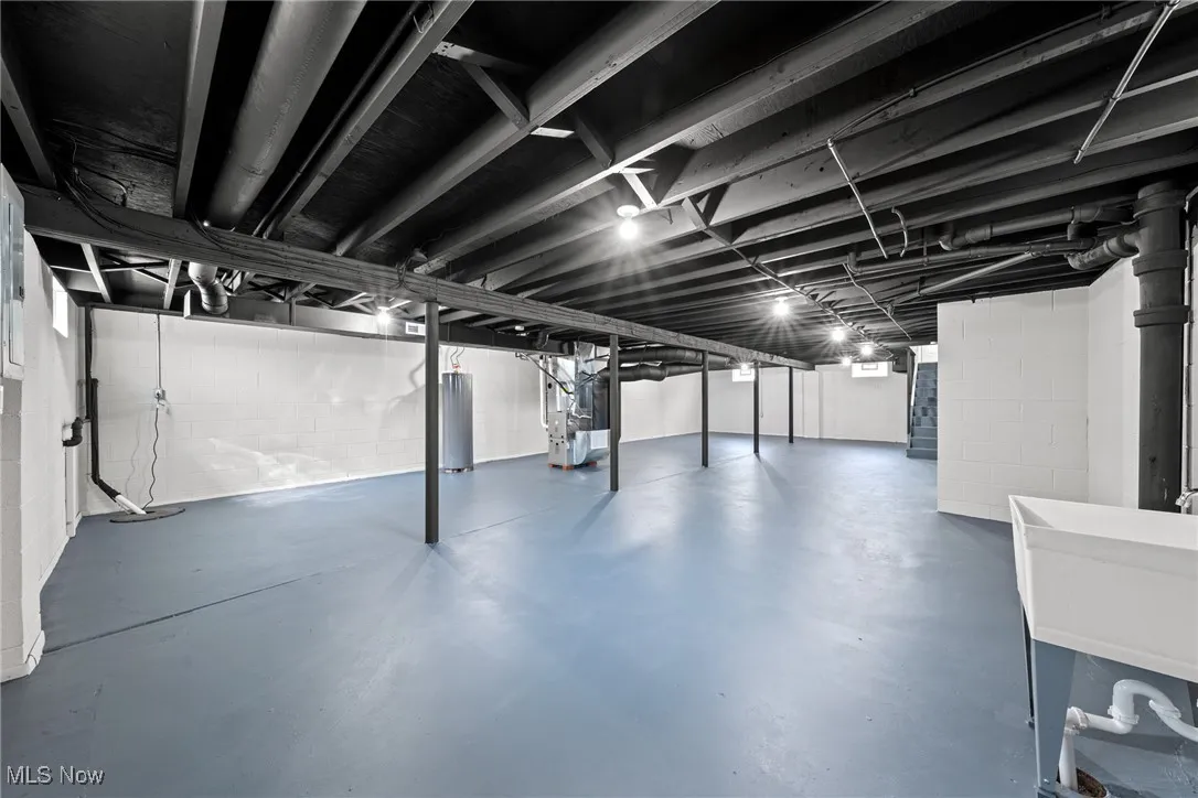 Basement with gas water heater and heating unit