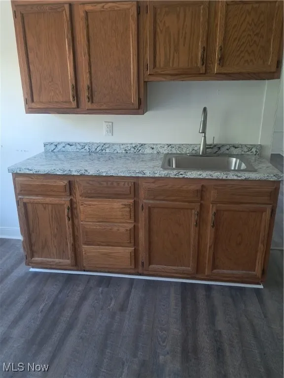 Kitchen with LVT flooring, new counter, sink and faucet