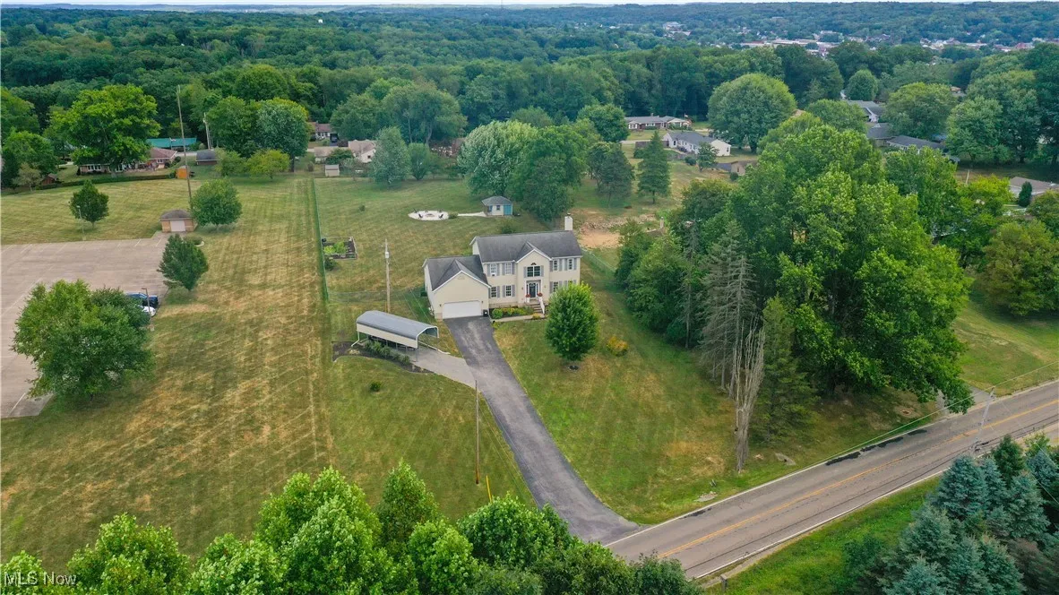 Aerial overview of property's location with a forest