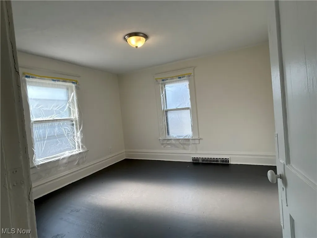 Spare room with baseboards
