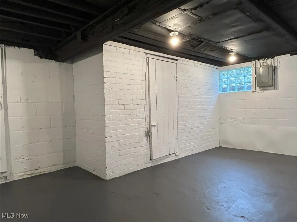 Below grade area with electric panel