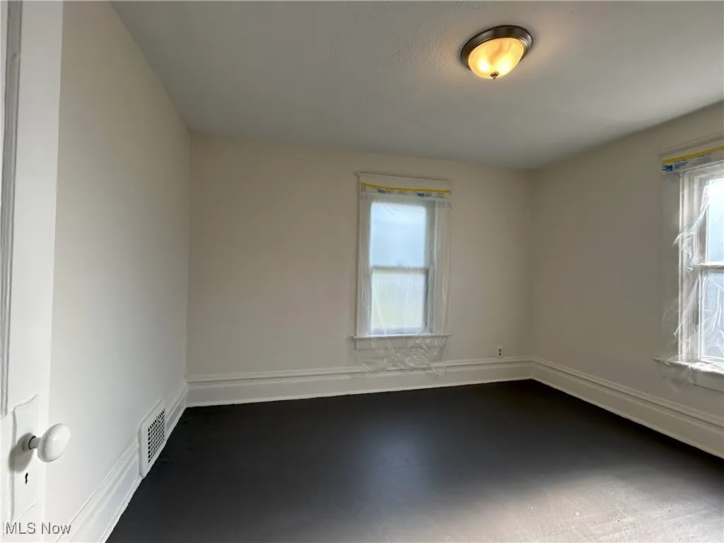 Spare room with baseboards