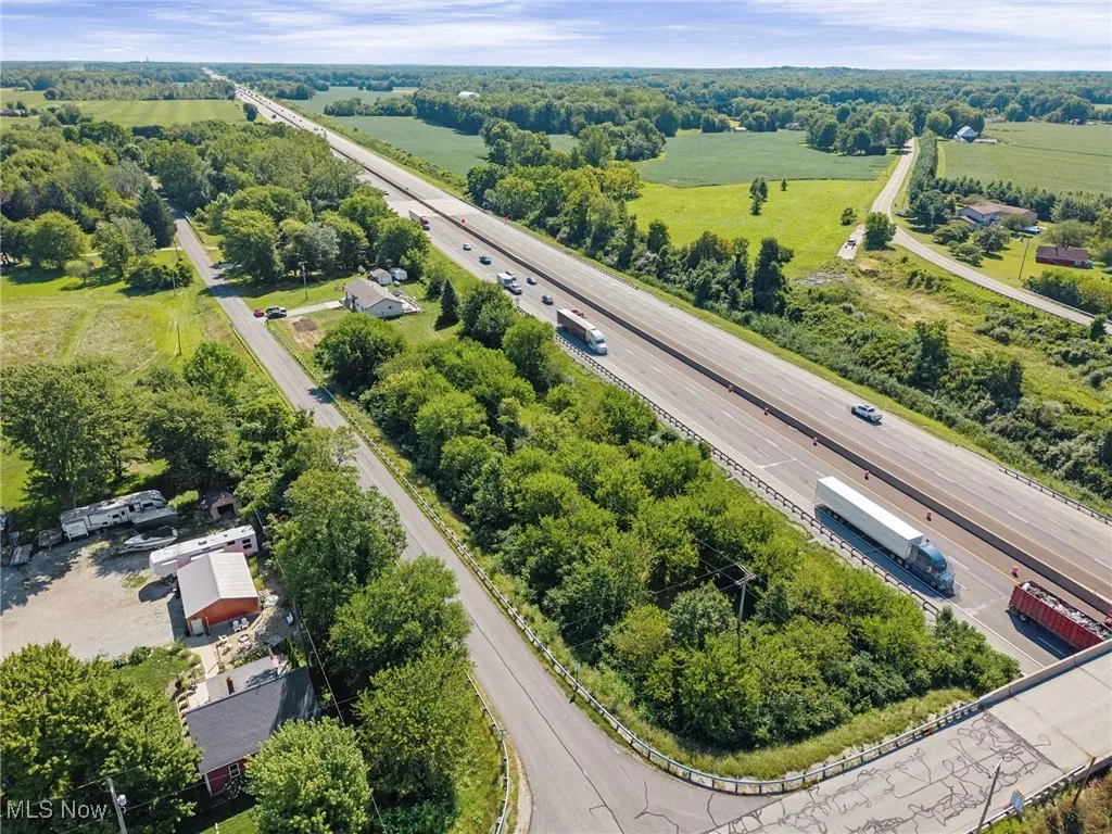 Aerial view of a main thoroughfare and a tree filled landscape