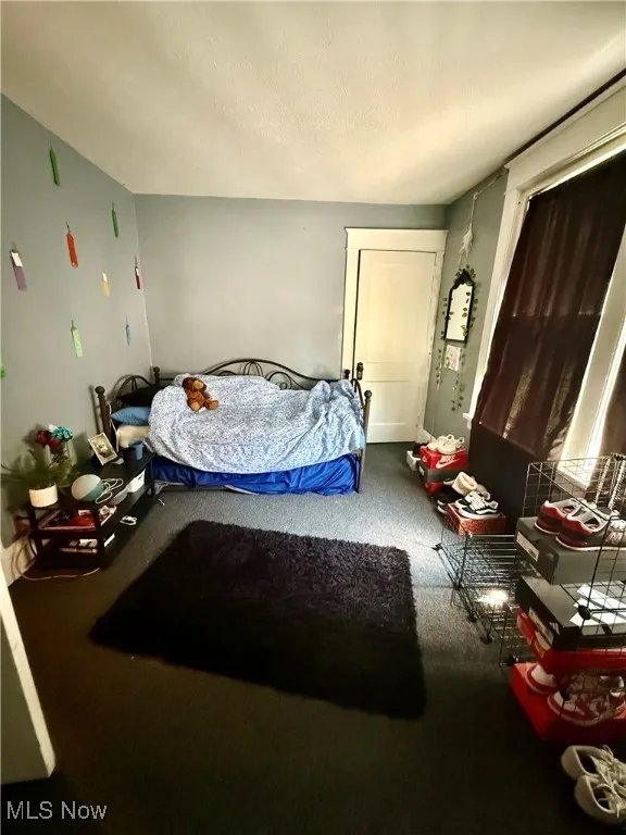 Bedroom featuring a textured ceiling