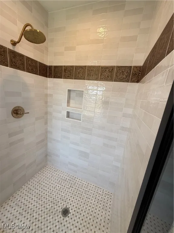 Bathroom with tiled shower