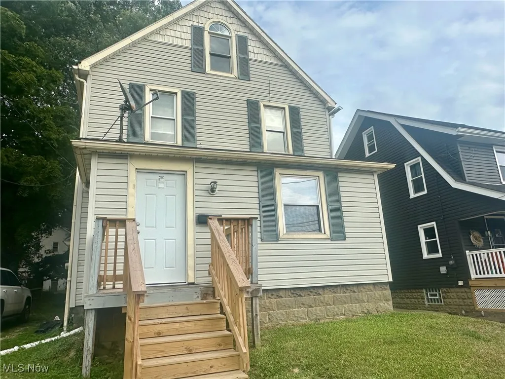 View of front of property with a front yard