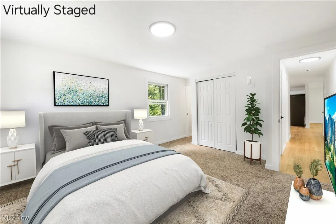 Bedroom featuring a closet and carpet