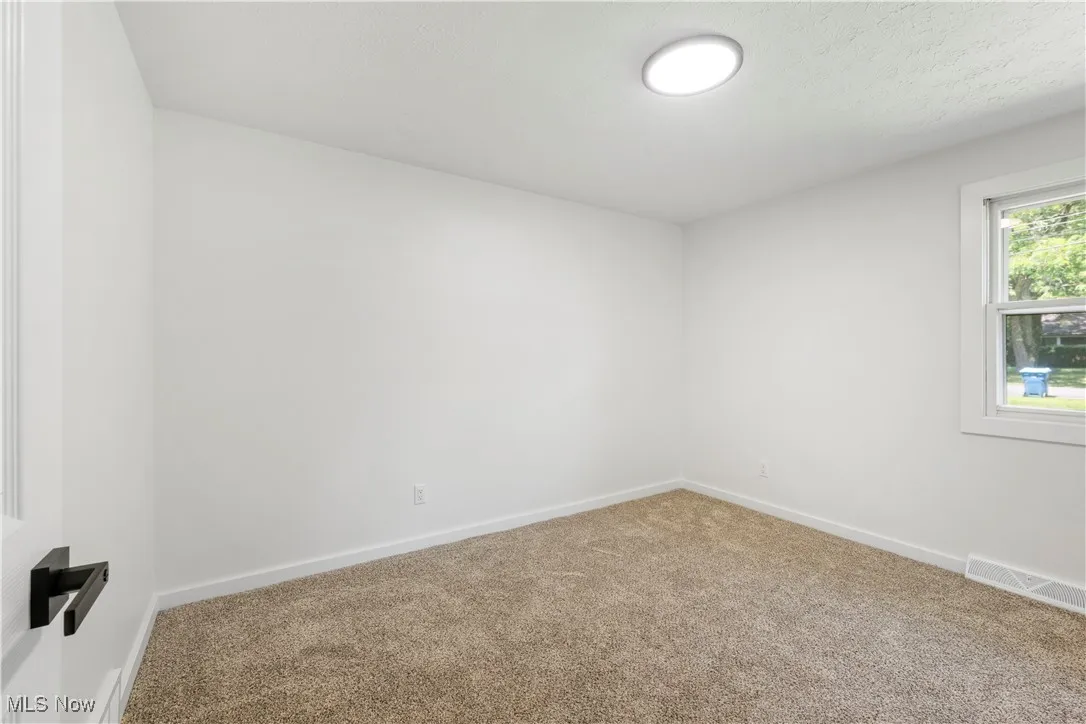 Spare room with carpet flooring