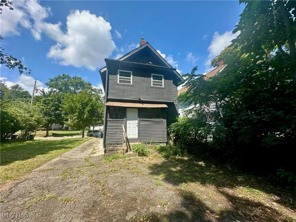 Back of property with a chimney