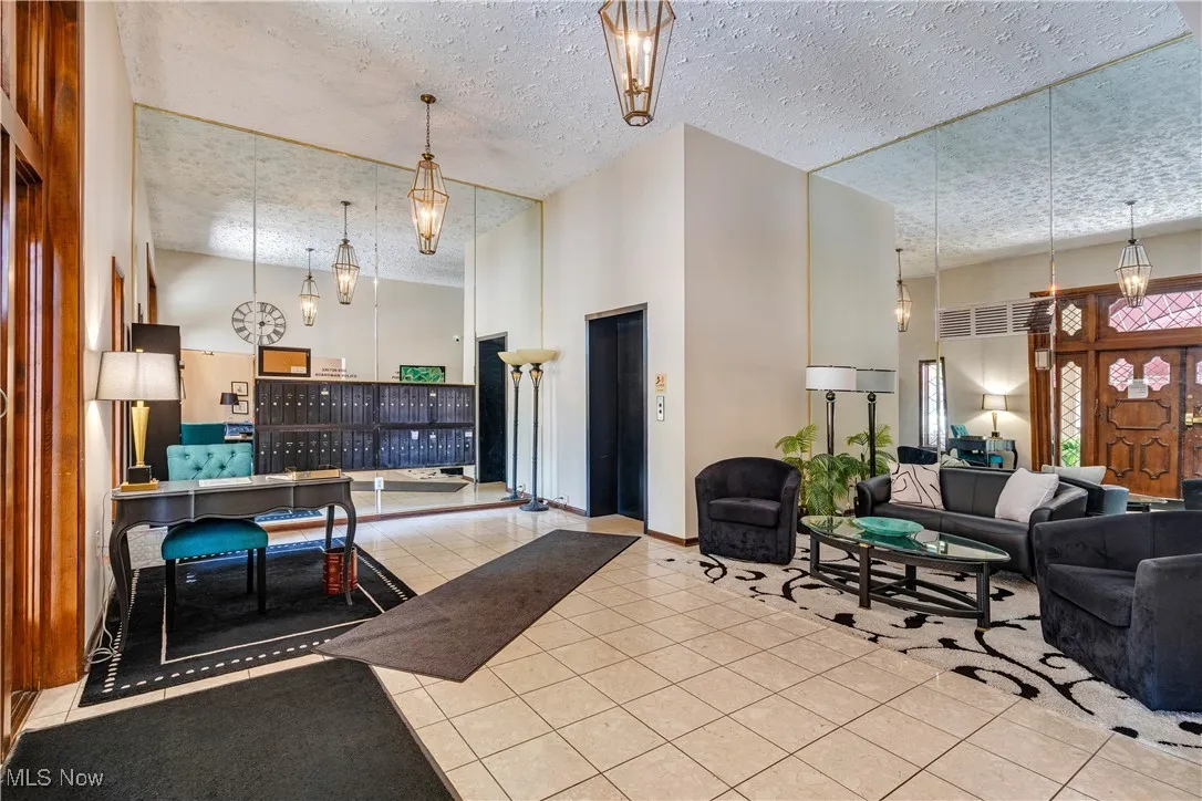 Community lobby with a towering ceiling and a textured ceiling