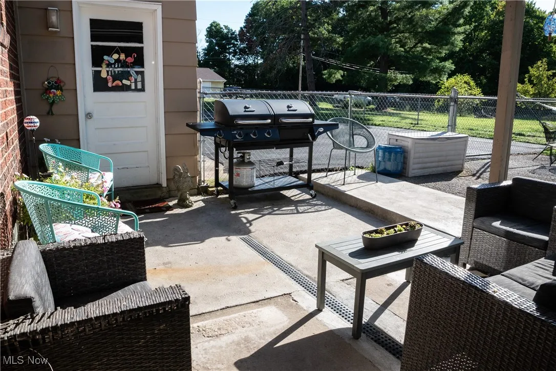 View of patio / terrace with grilling area and an outdoor hangout area