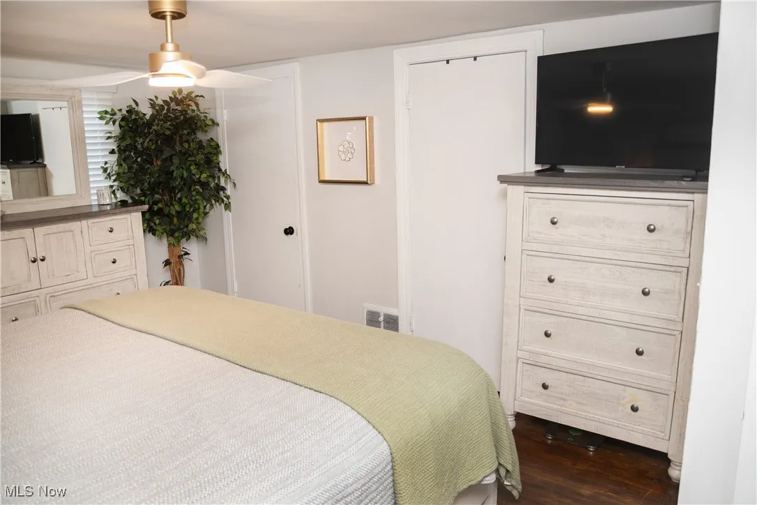 Bedroom featuring dark wood-style floors