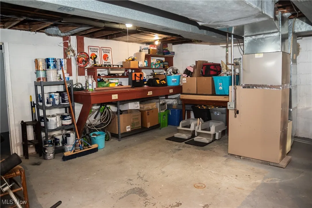 Unfinished below grade area with heating unit