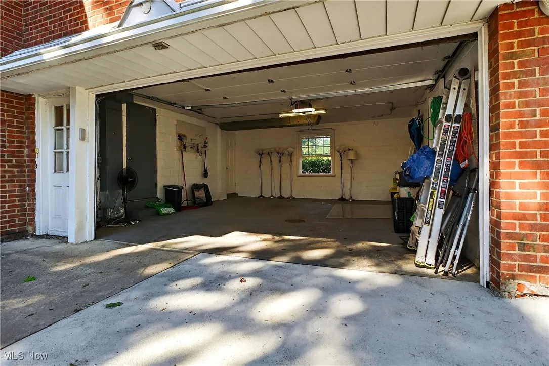 Garage featuring driveway