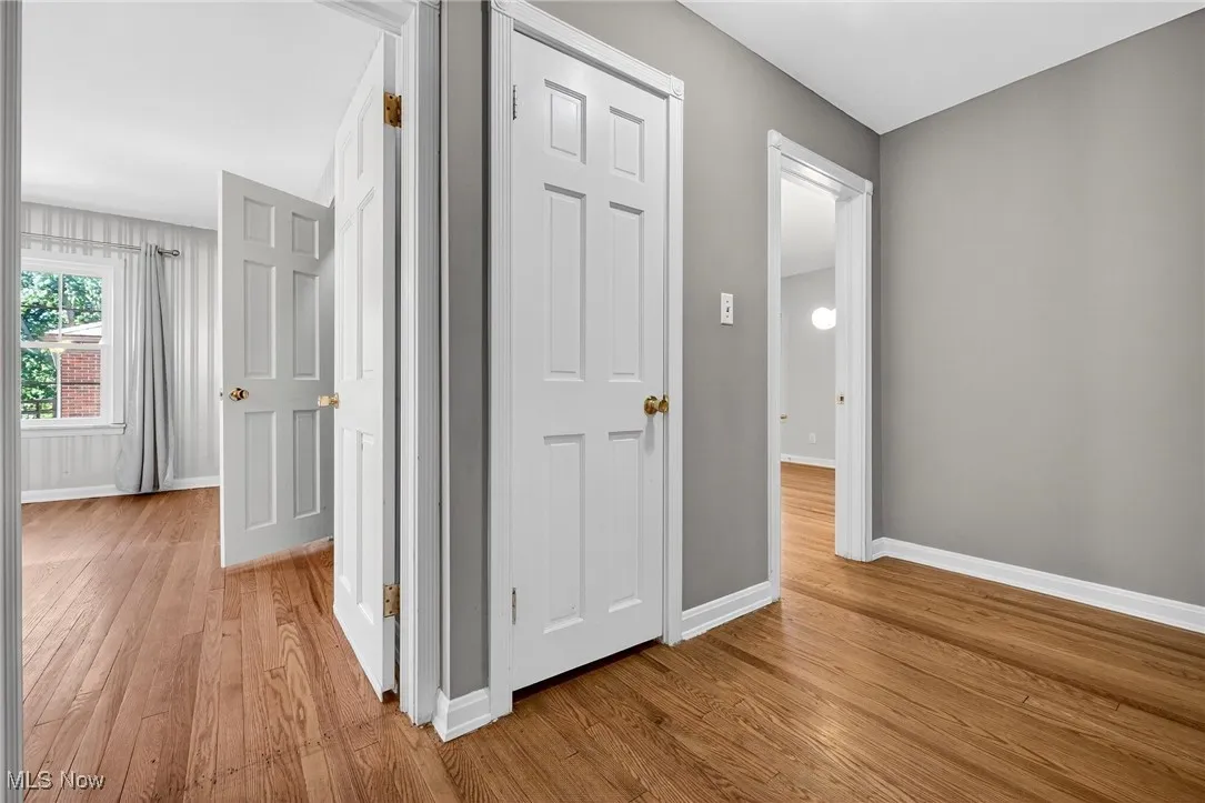 Corridor featuring light wood-type flooring