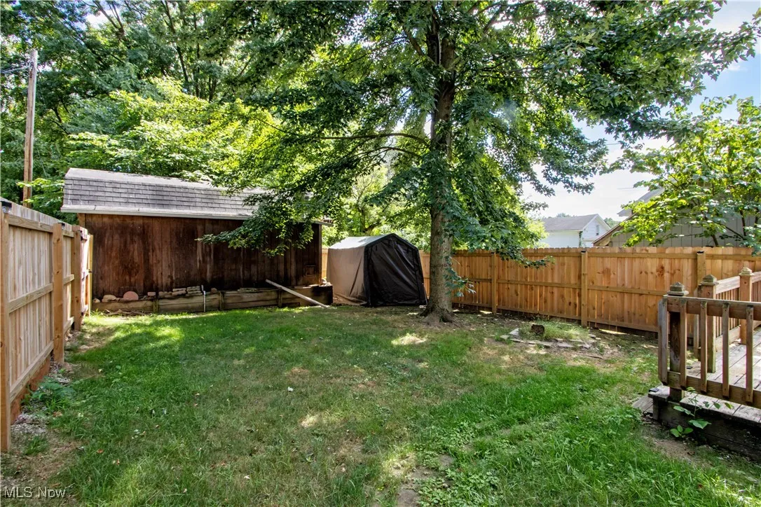 View of fenced backyard