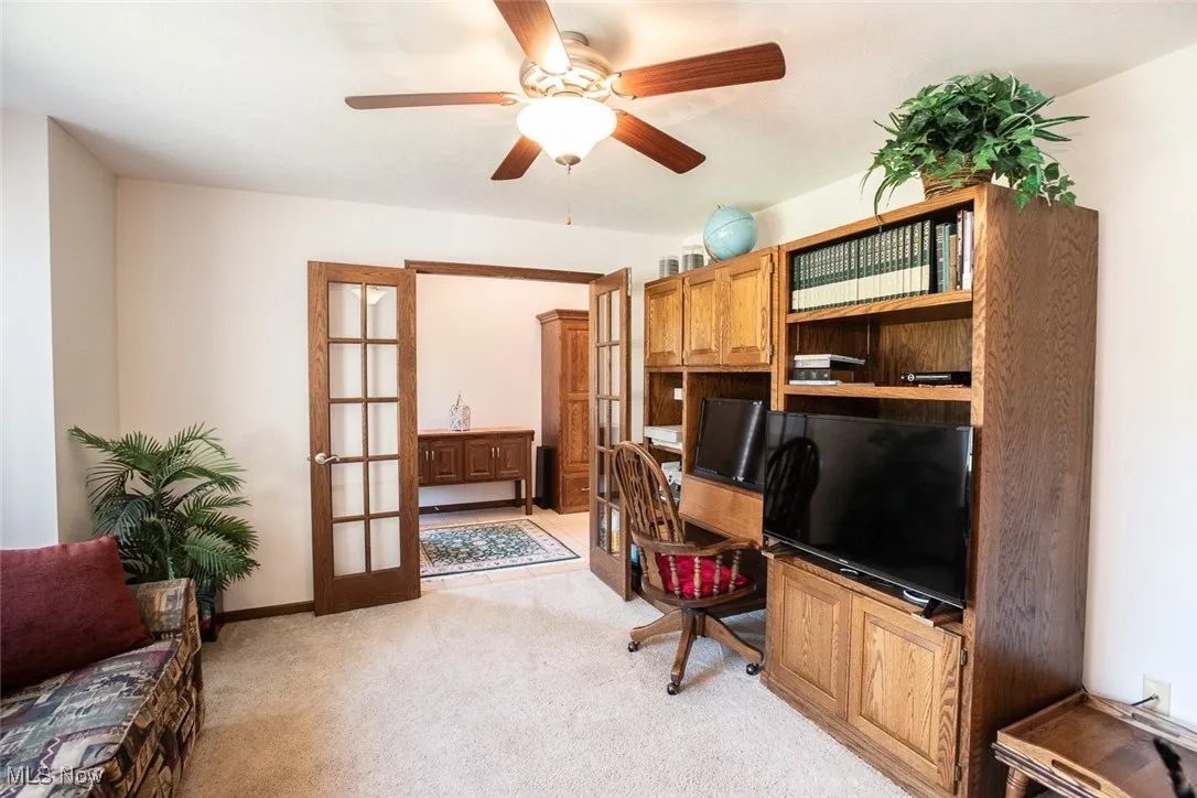 At the front of the house, an extra living room features French doors making it a perfect private space for a home office