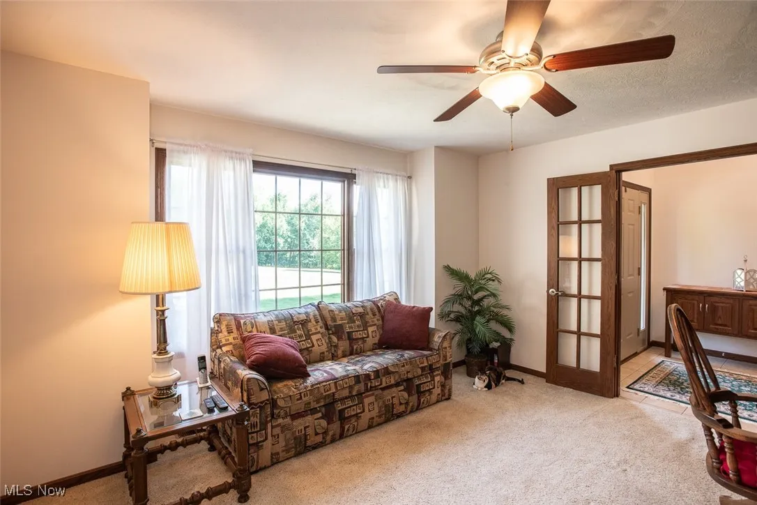 At the front of the house, an extra living room features French doors making it a perfect private space for a home office