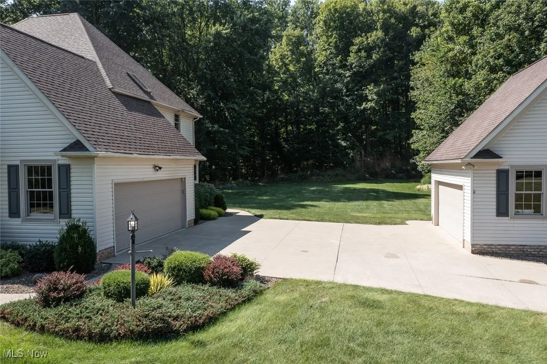 Two-car-attached garage and an additional detached two-car garage