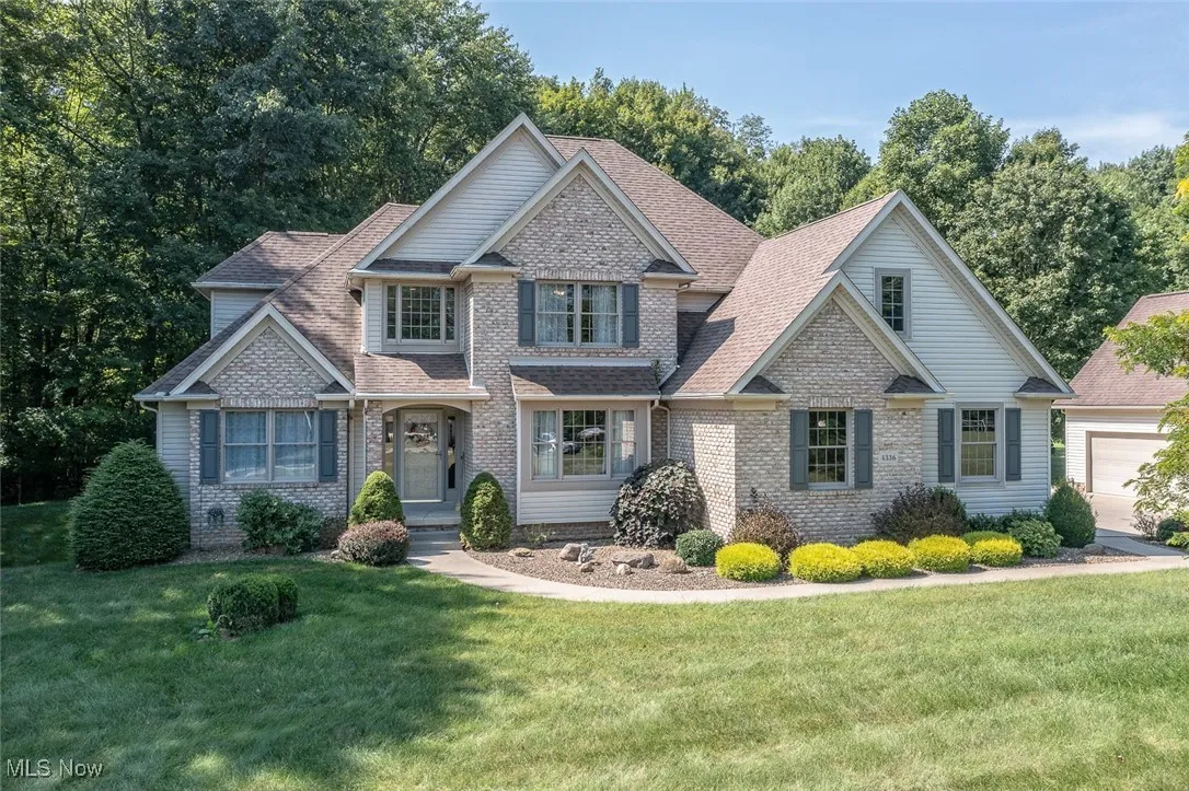 Welcome home to this beautiful custom home on a private 3.22 Acres within the desirable Copley School District.