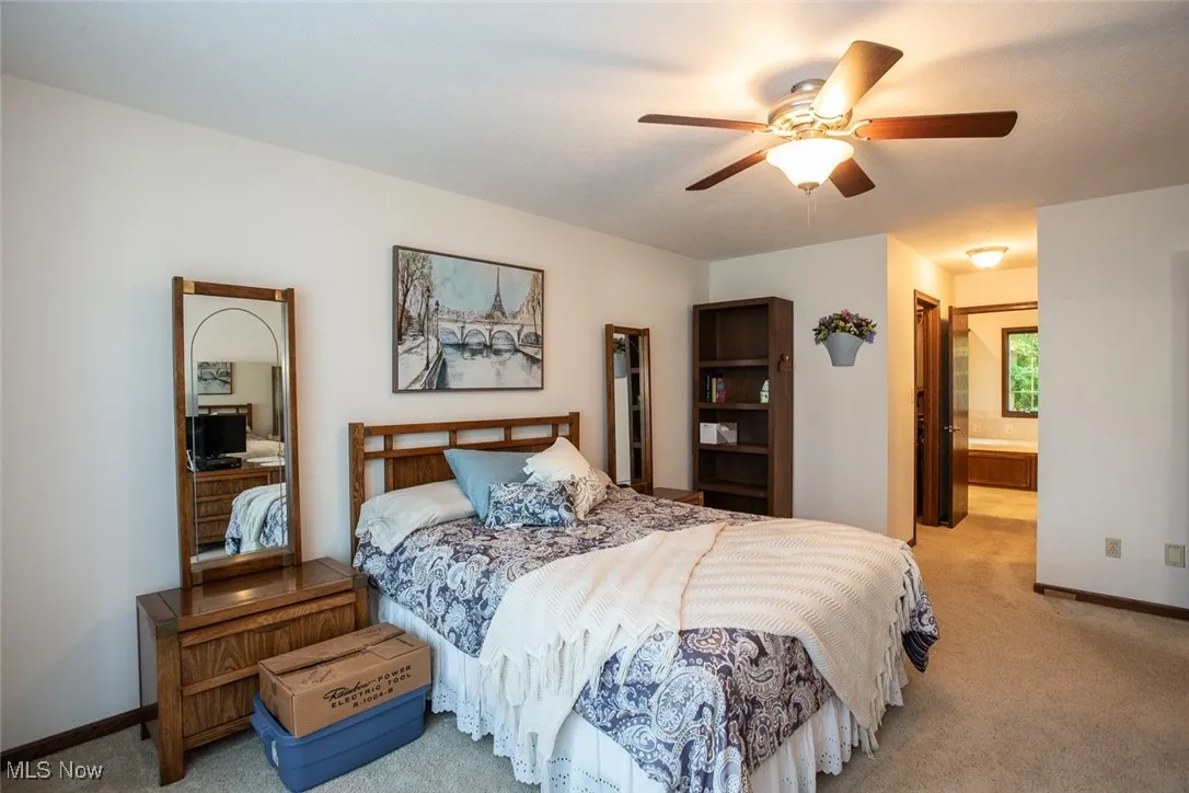 Owner's suite with two walk-in closets and an adjoining bathroom