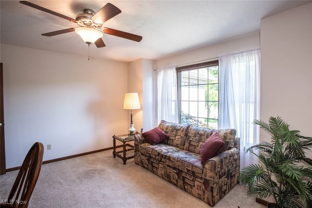 At the front of the house, an extra living room features French doors making it a perfect private space for a home office
