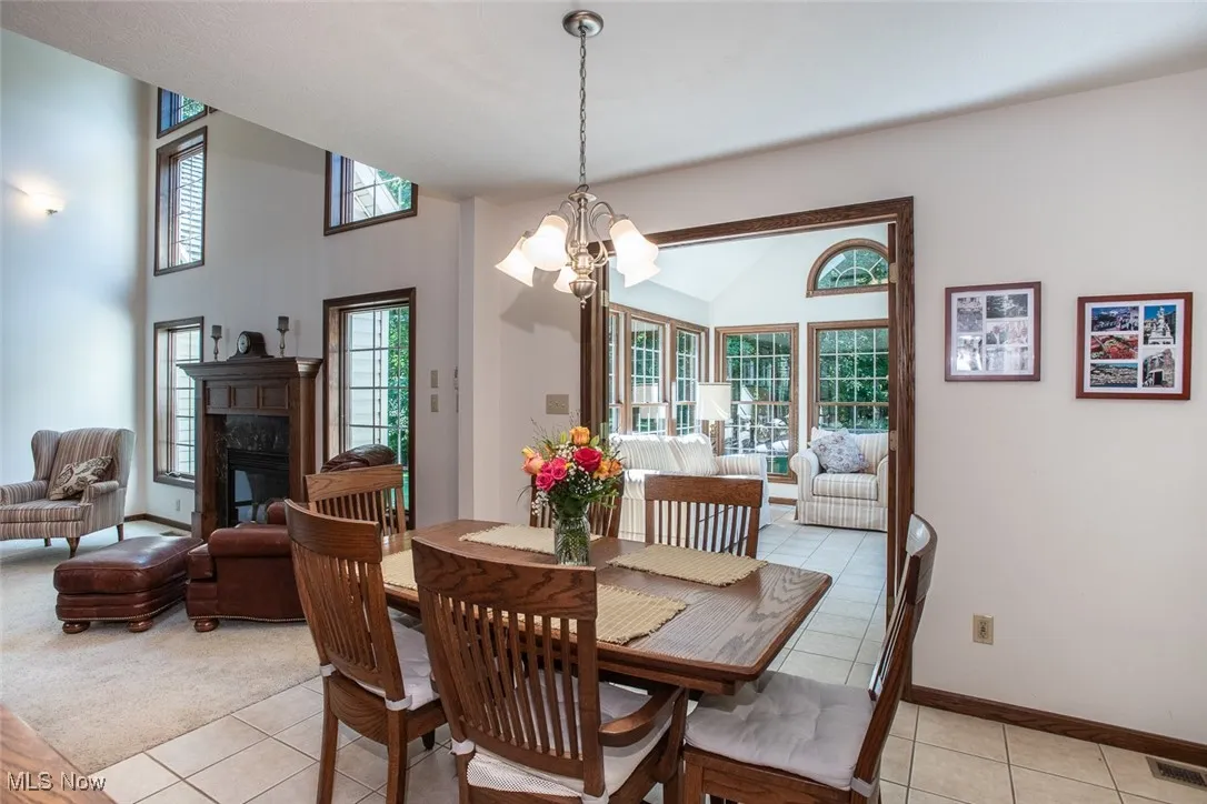 Dining area that opens into the kitchen and sunroom.